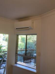 Wall mounted split system installed in a living room.