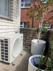 Daikin outdoor ac unit on a balcony floor