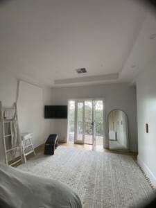 Square ceiling grill installed in a master bedroom at Neutral bay