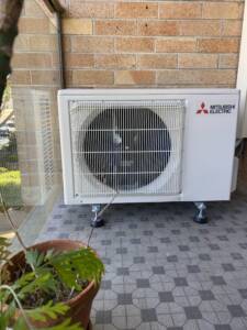 Mitsubishi outdoor ac unit installed on a balcony