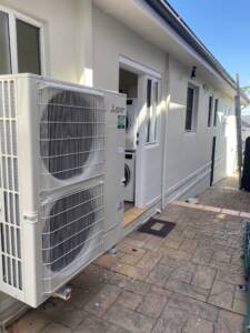 Mitsubishi Electric condenser unit installed on a sideway at Seaforth